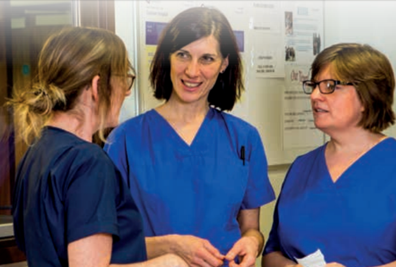 Midwives talking at work